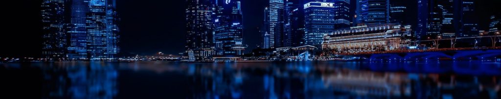 illuminated-cityscape-against-blue-sky-at-night-316093